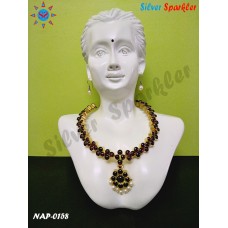 Beautiful Temple jewellery simple stone necklace with flower and pearl hangings.